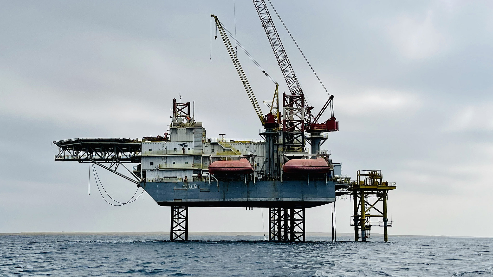 A crane helps other vessels searching for oil and natural gas near the oil platform offshore the Red Sea in Ras Behar, Egypt, January 29, 2023. /CFP