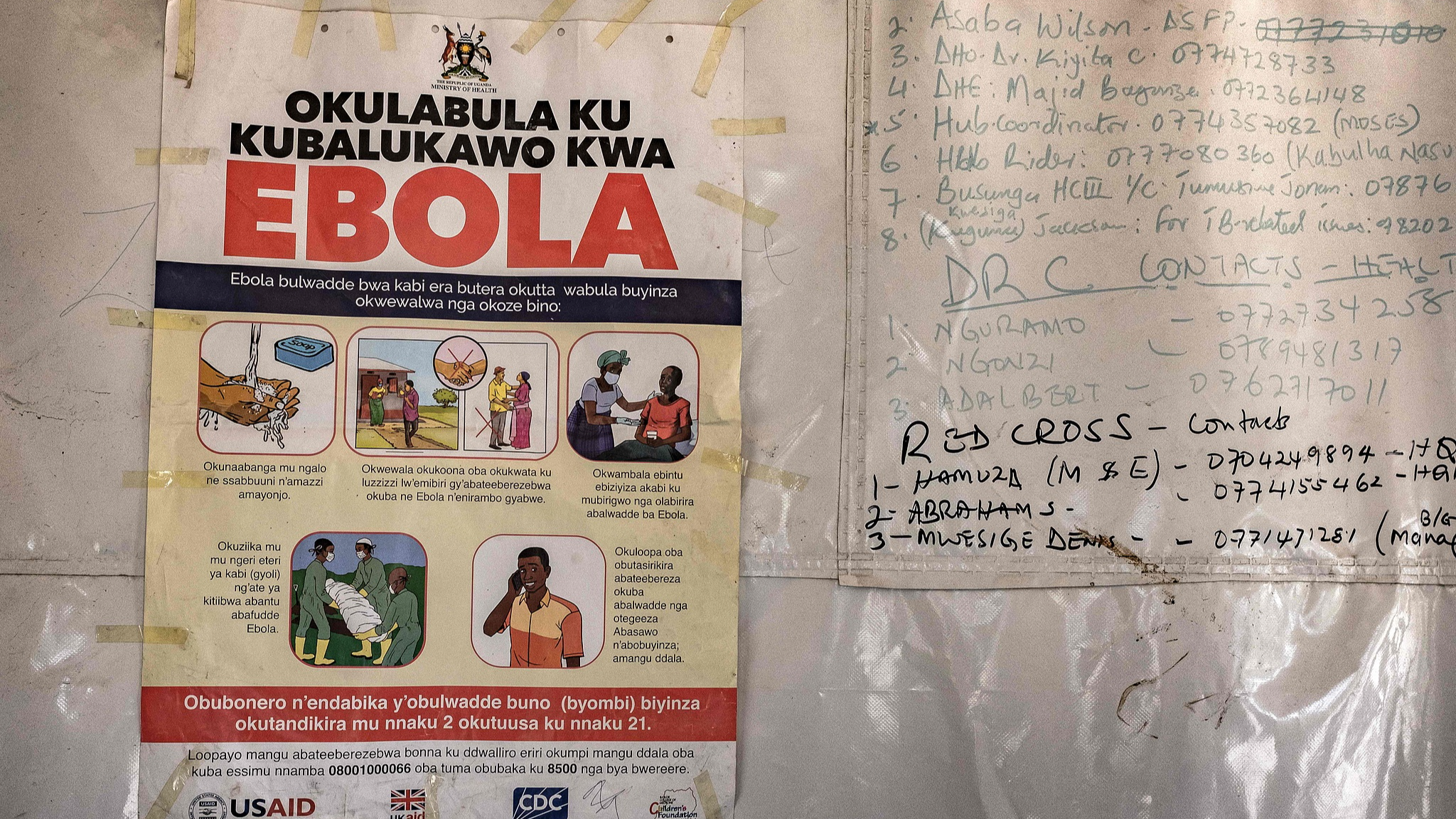 A poster displaying an Ebola emergency contact number was displayed on a tent at the Businga border crossing between Uganda and the Democratic Republic of Congo in Bundibugyo, Uganda on May 18, 2026. /CFP