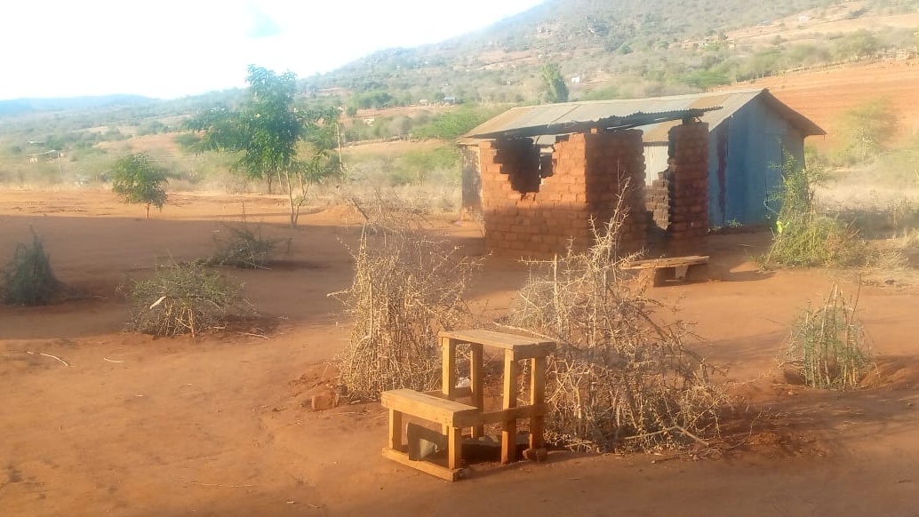 A desk in the middle of the compound displaying how the Mawani Comprehensive School looked before the planting of the school garden, in Makueni county, Kenya. 