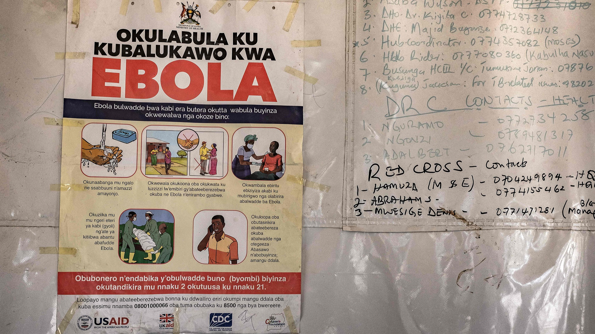 A poster displaying an Ebola emergency contact number was displayed on a tent  the Businga border crossing between Uganda and the Democratic Republic of Congo in Bundibugyo, Uganda. /CFP