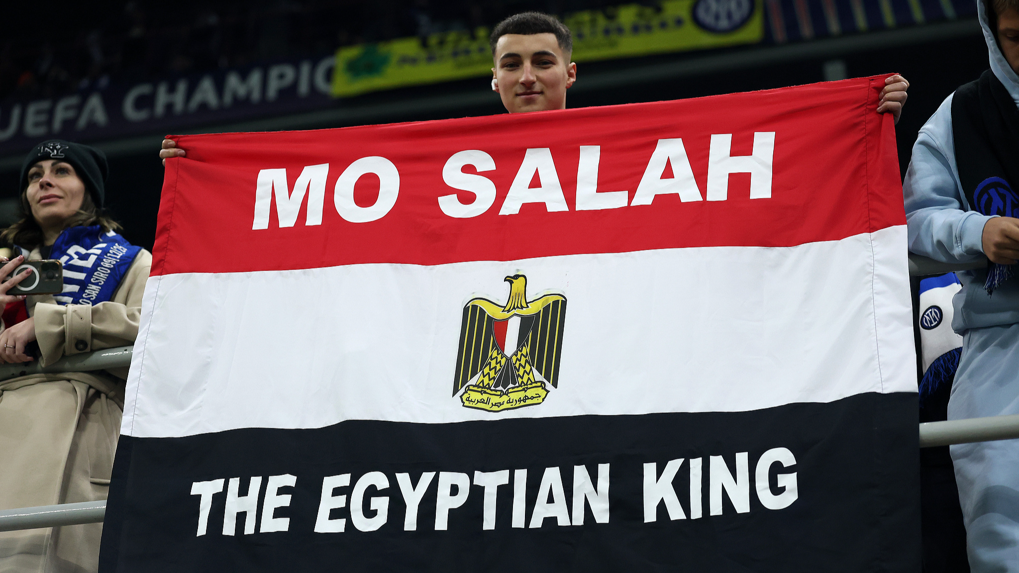 A fan of FC Inter Milano holds a flag in the stands dedicated to Mohamed Salah of Liverpool and Egypt during the UEFA Champions League League match between Inter Milan and Liverpool FC at Stadio San Siro in Milan, Italy, December 09, 2025. /CFP