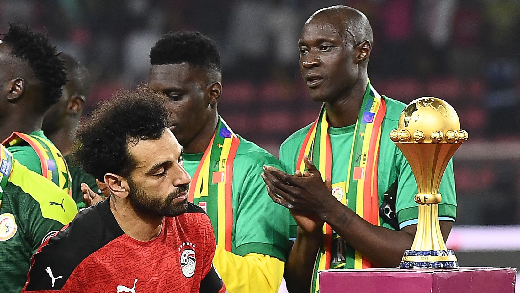 Egypt's forward Mohamed Salah walks past the trophy after losing the Africa Cup of Nations (CAN) 2021 final football match between Senegal and Egypt at Stade d'Olembe in Yaounde, Cameroon, February 6, 2022. /CFP