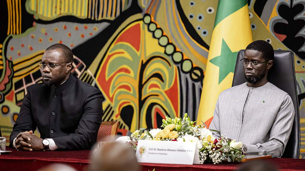 Senegalese Prime Minister Osman Sonko (left) and Senegalese President Bassirou Diomaye Faye attended a ceremony at the Presidential Palace to receive the official report on the Tiaroye genocide, in Dakar, Senegal, October 16, 2025. /CFP 