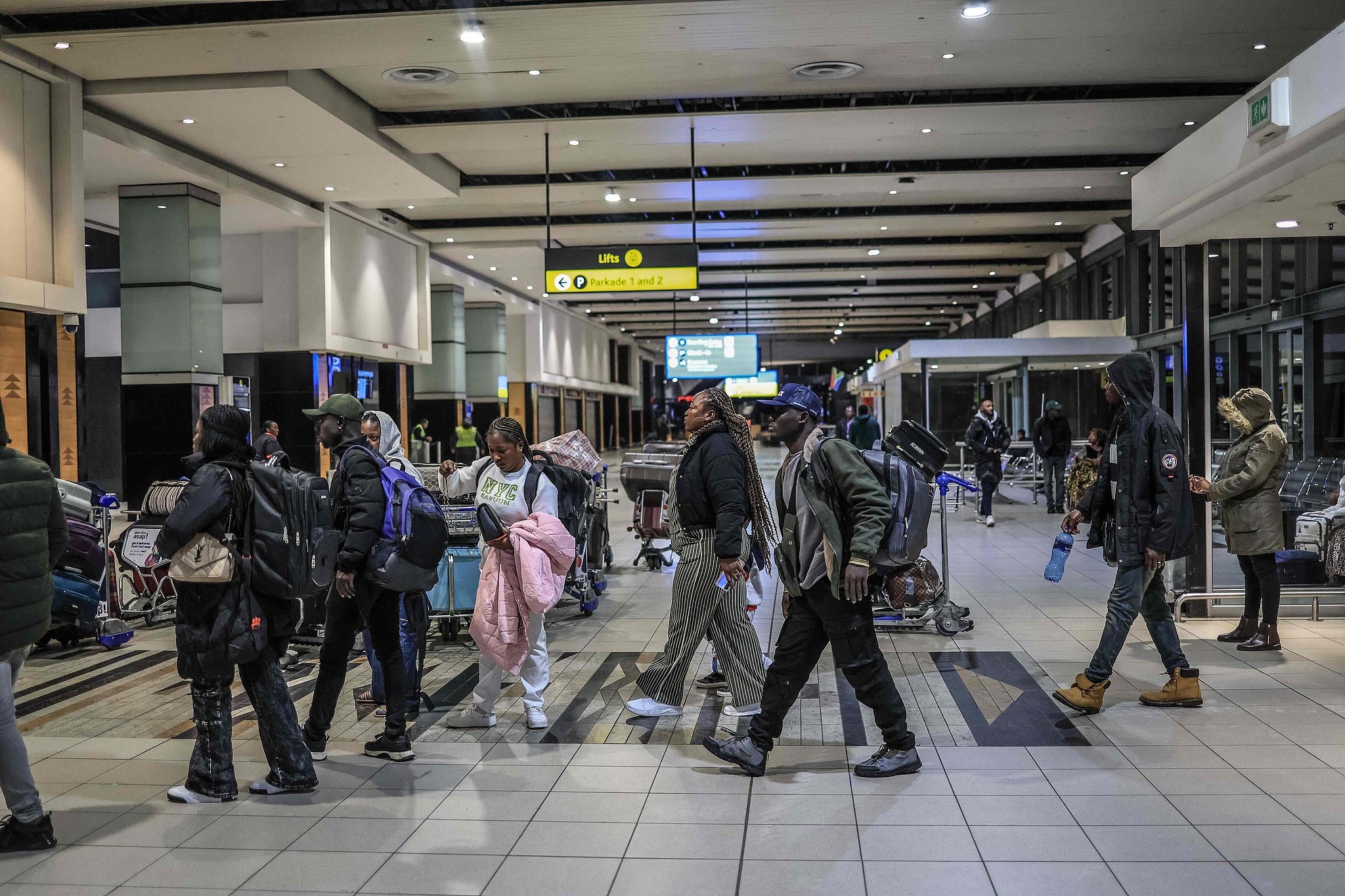 Ghanaian nationals arrive for an evacuation flight at OR Tambo International Airport in South Africa on May 27, 2026. /CFP