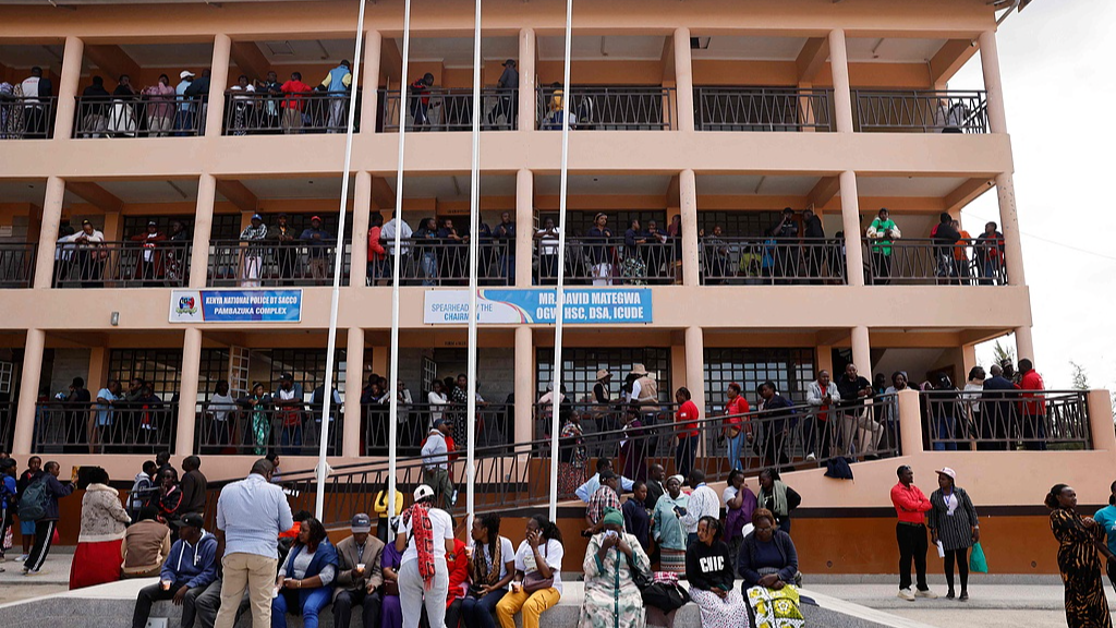 Parents and guardians stand near the administration building of Utumishi Girls Academy in Nakuru, Kenya, May 28, 2026. /CFP
