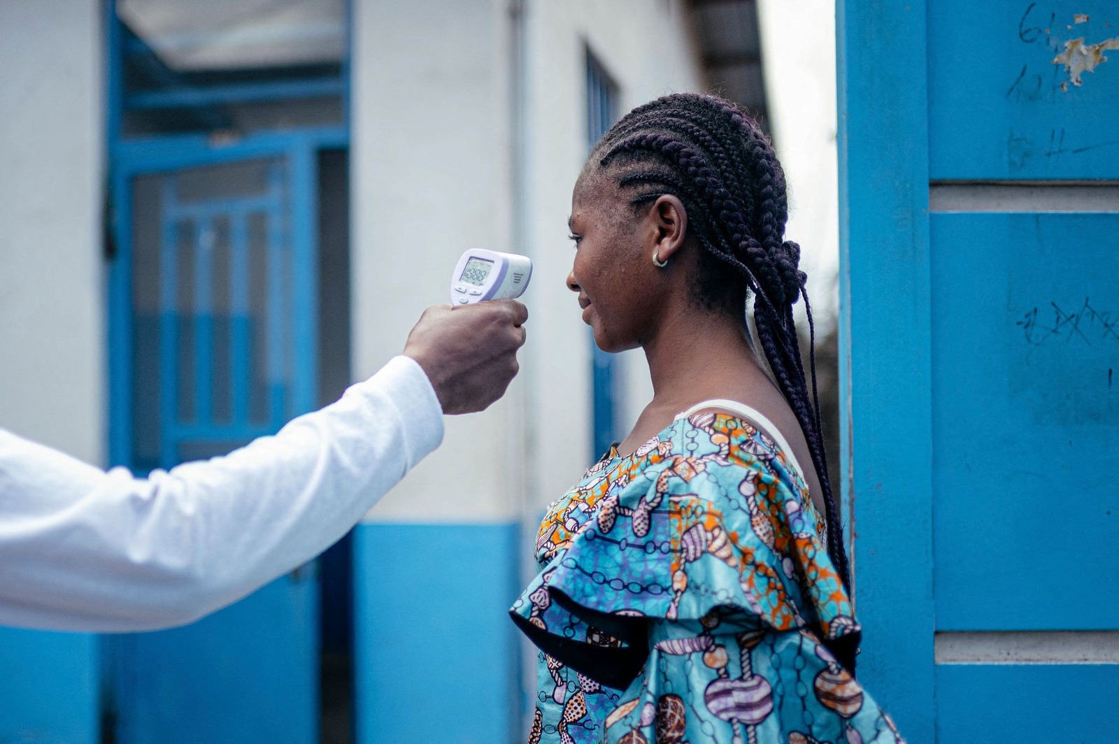 A woman’s temperature is measured using a contactless infrared thermometer before entering a hospital in Goma, DR Congo, on May 17, 2026. /CFP