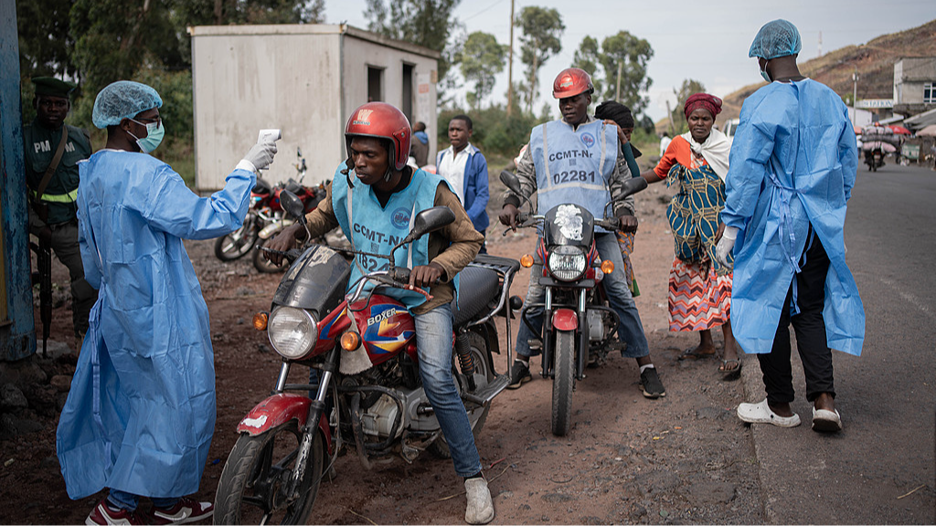Health workers wearing protective gowns and masks checked locals' temperatures as a preventative measure against Ebola, in Kanyaruchinya, near Goma, North Kivu Province, Democratic Republic of the Congo, May 27, 2026. /CFP