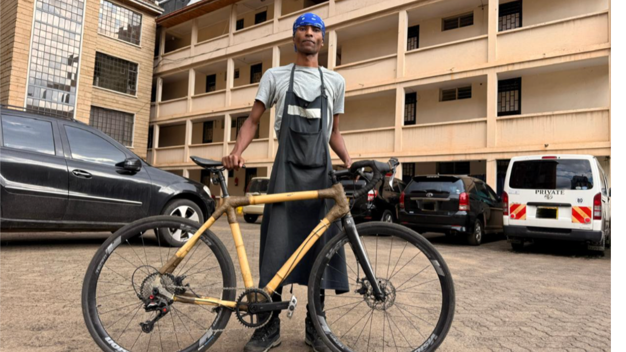 Kiruri stands with a bamboo bicycle in Nairobi, Kenya, on June 5, 2026. /Kiruri Murangi