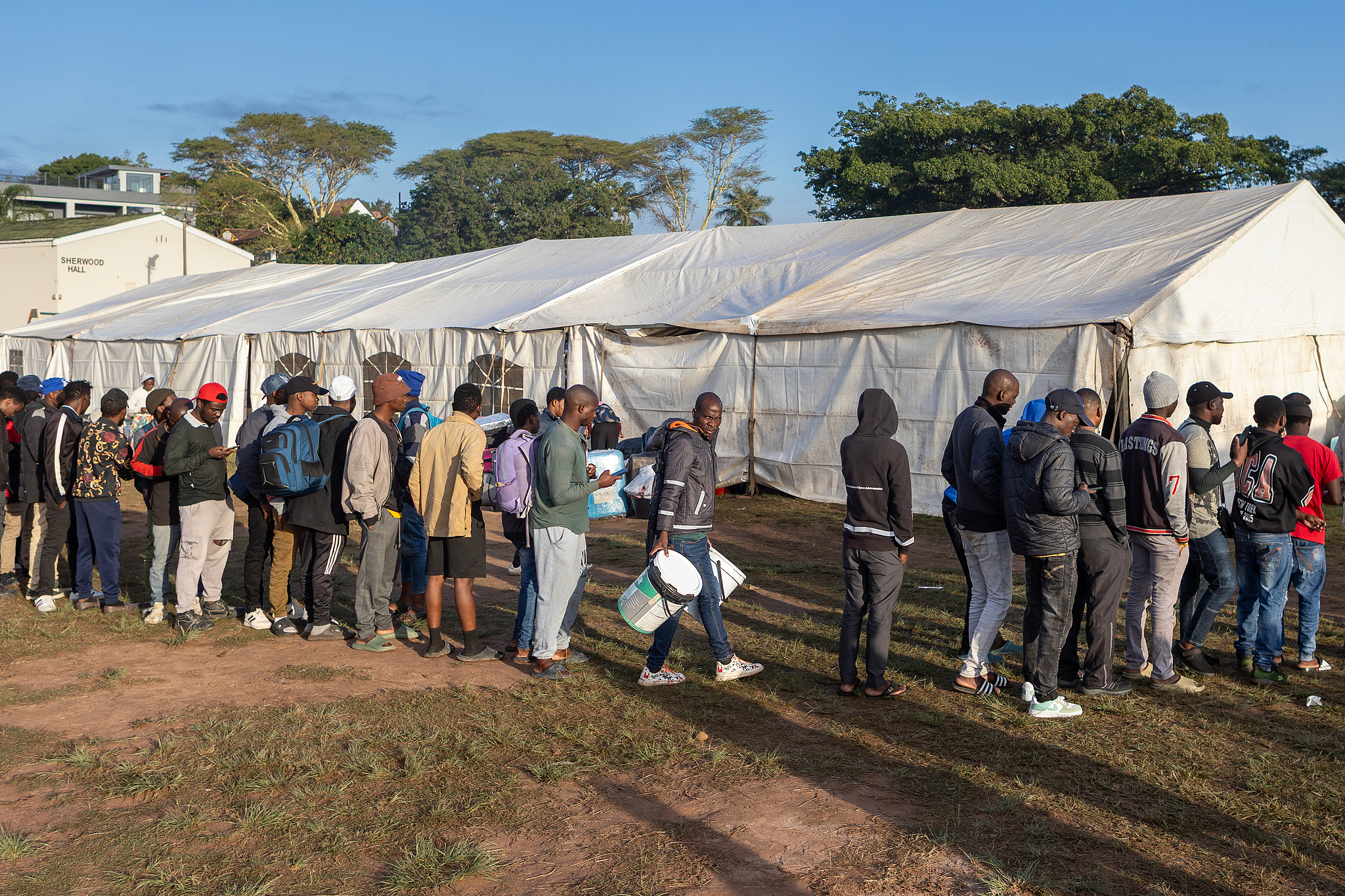 Malawi migrants to South Africa line up for supplies in an informal refugee camp in Sherwood, Durban, South Africa, 10 June 2026. /CFP