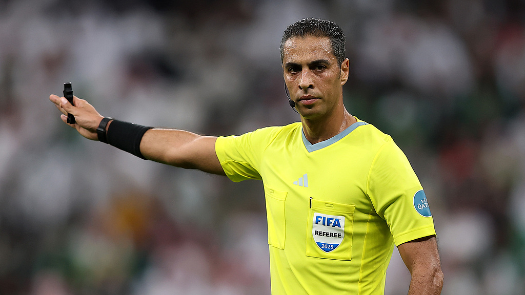 Referee Amin Mohamed Omar gestures during the FIFA Arab Cup 2025 Quarter Final match between Palestine and Saudi Arabia at Lusail Stadium on December 11, 2025 in Lusail City, Qatar. /CFP