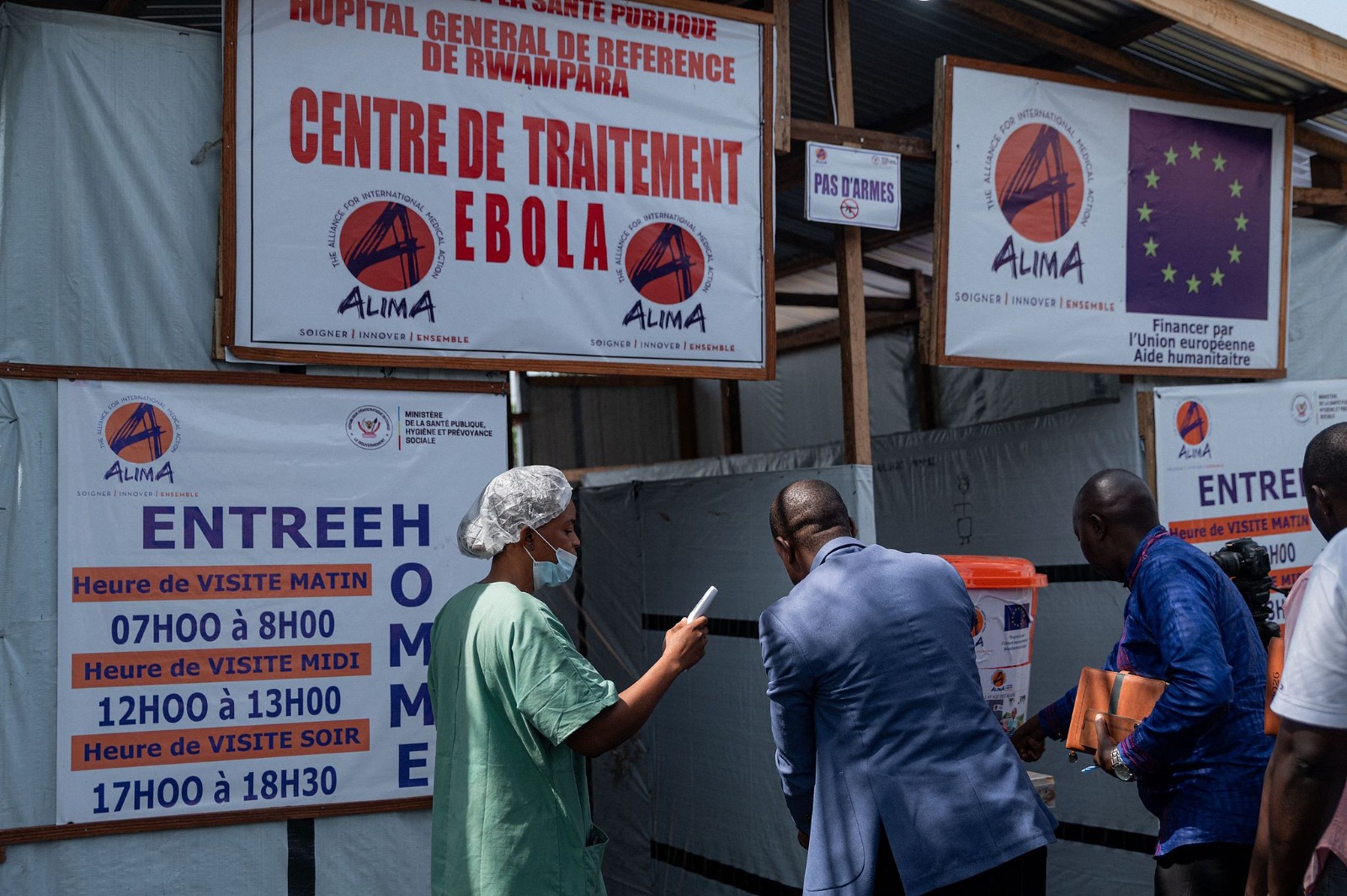 Officials from the Ituri Provincial Health Division, humanitarian partners and health sector representatives undergo temperature screening and handwashing before entering the Ebola treatment centre of Rwampara General Reference Hospital in Rwampara, Ituri Province, Democratic Republic of Congo, June 12, 2026. /CFP