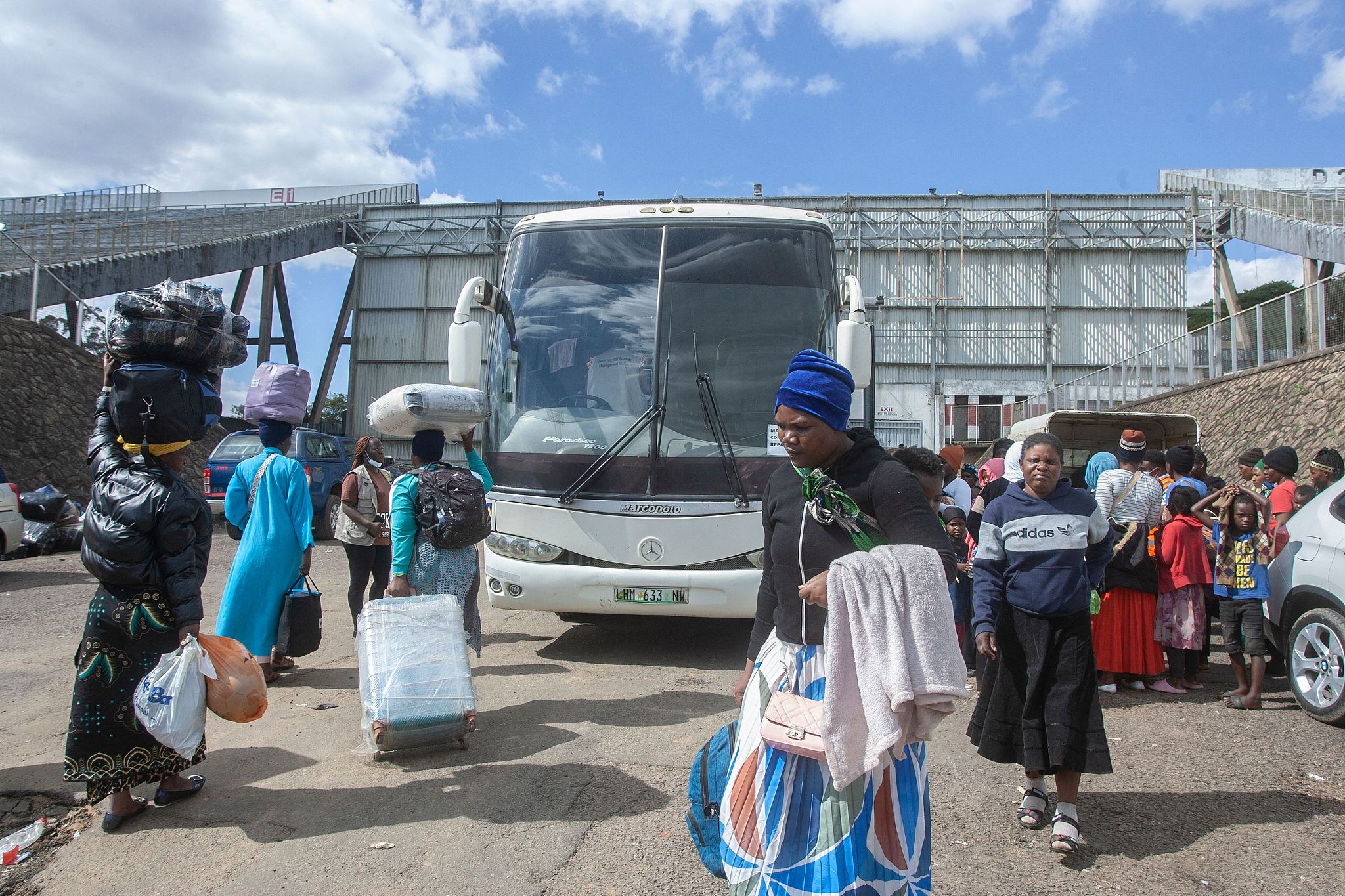 Malawians repatriated from South Africa arrive at Kamuzu Stadium, the country's receiving camp, on June 18, 2026. /CFP