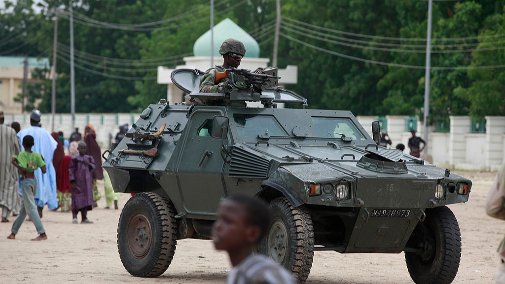 FILE: Nigerian soldiers ride on an armored personnel carrier during Eid al-Fitr celebrations in Maiduguri, in Borno state, Nigeria, August 8, 2013. /CFP