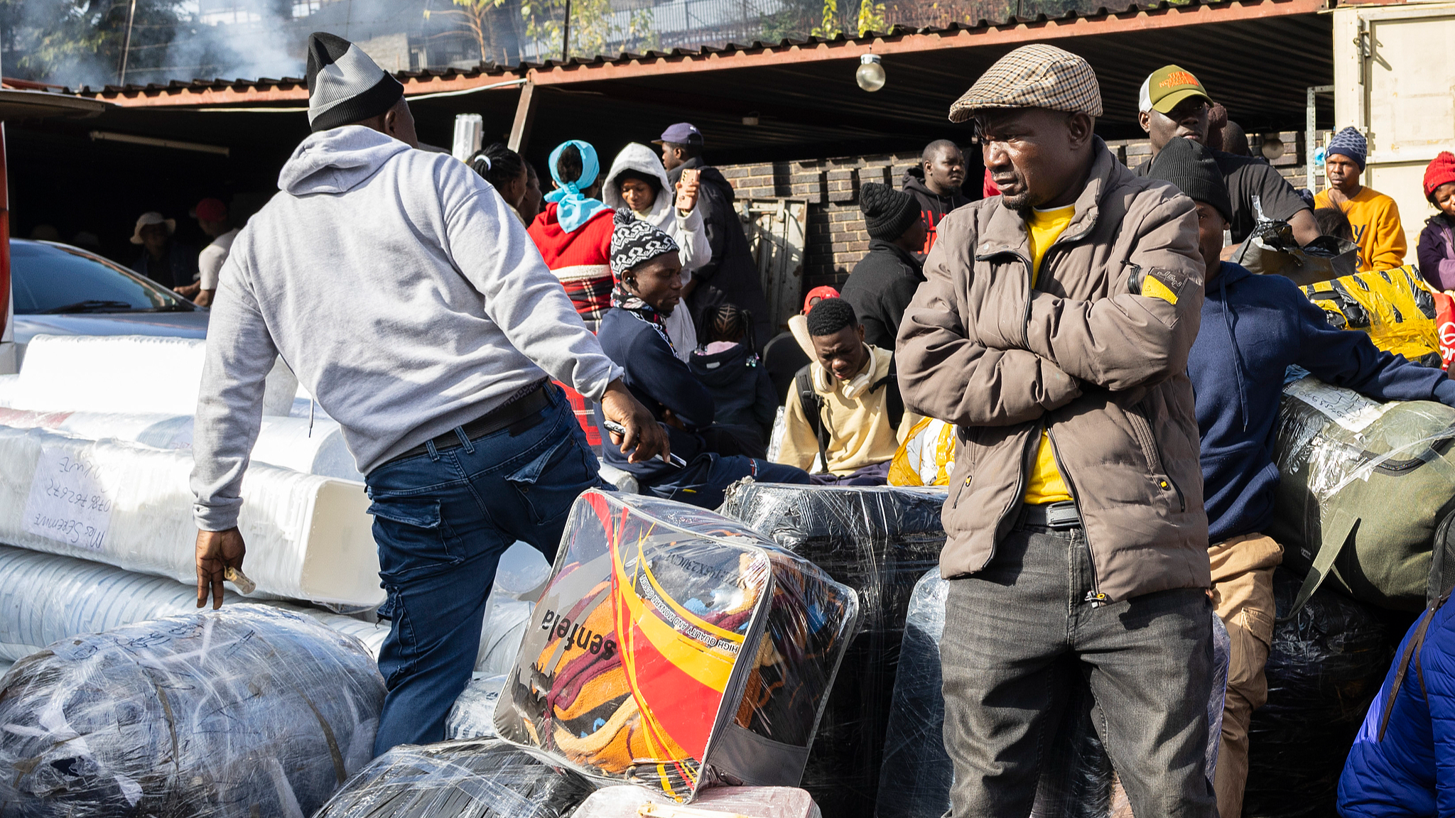 Zimbabwean nationals prepare to board a bus bound for Zimbabwe as a nationwide anti-immigrant movement has set June 30 as a deadline for undocumented migrants to leave the country in Johannesburg, South Africa on June 27, 2026. /CFP