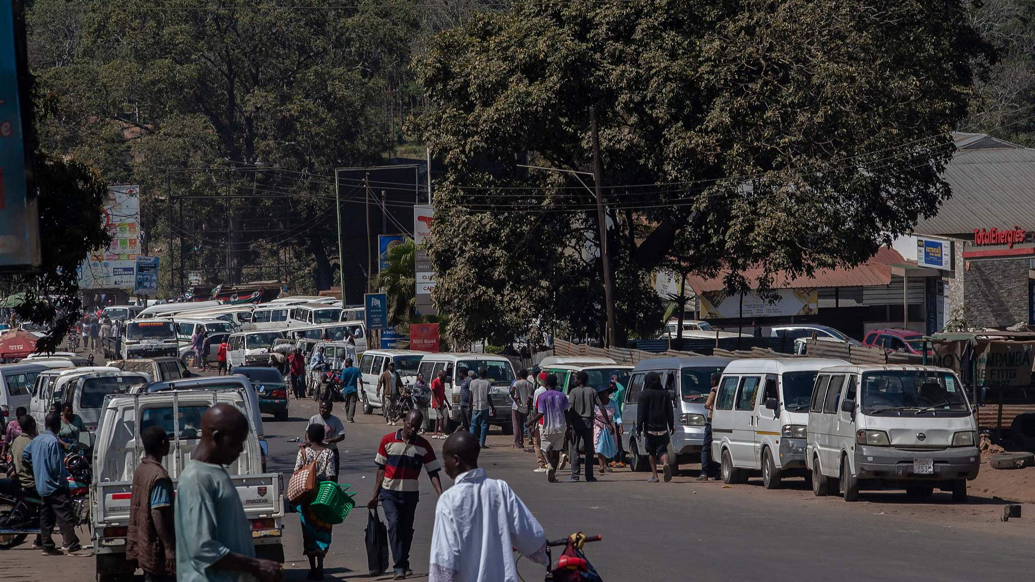 Minibuses lined up near a gas station at a commuter center near the Limbe town market, in Blantyre, Malawi, August 10, 2025. /CFP