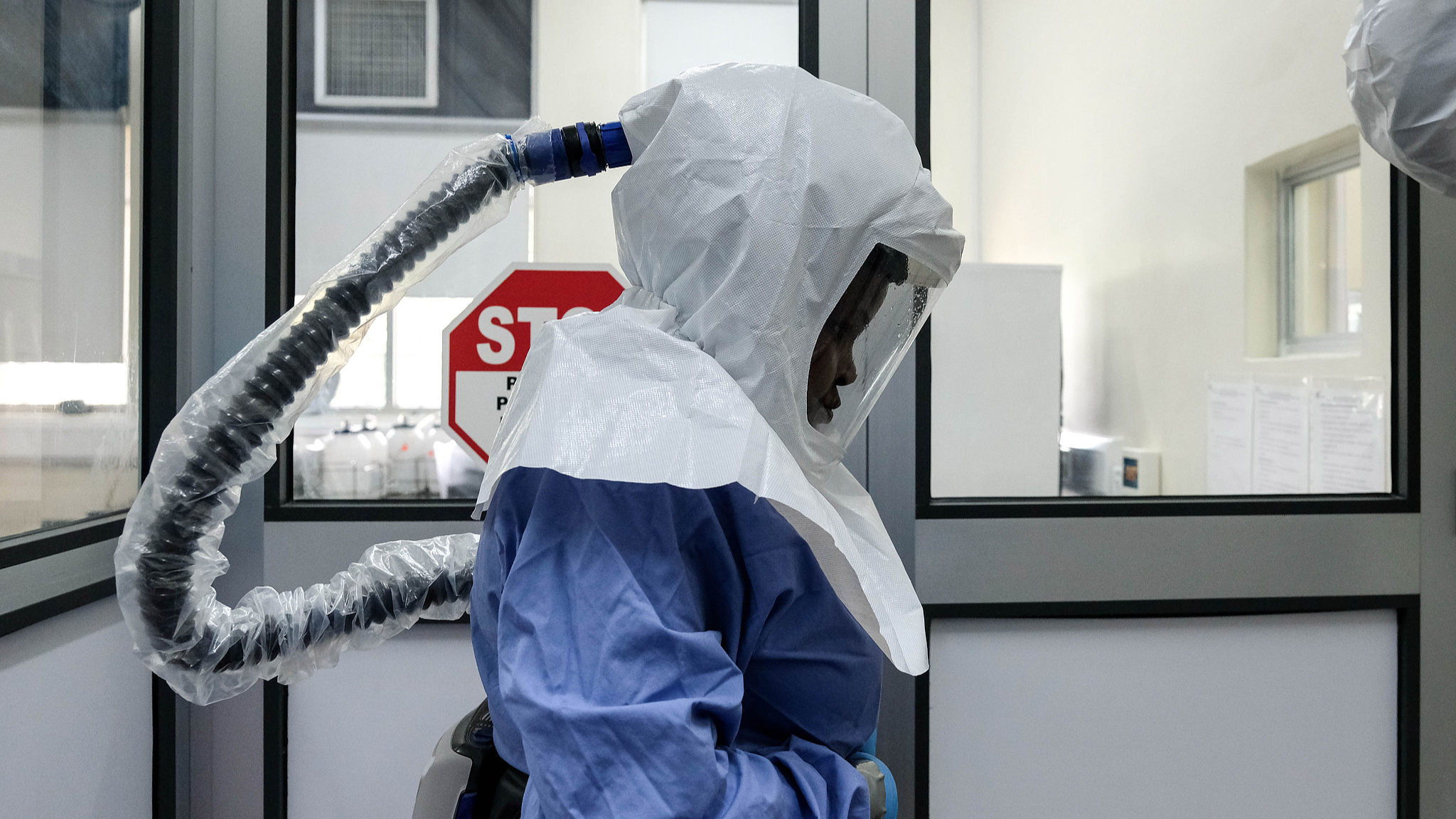 A laboratory technologist wearing protective equipment prepares to enter the Viral Hemorrhagic Fever Laboratory at the Uganda Virus Research Institute in Entebbe, Uganda, on May 26, 2026. /CFP