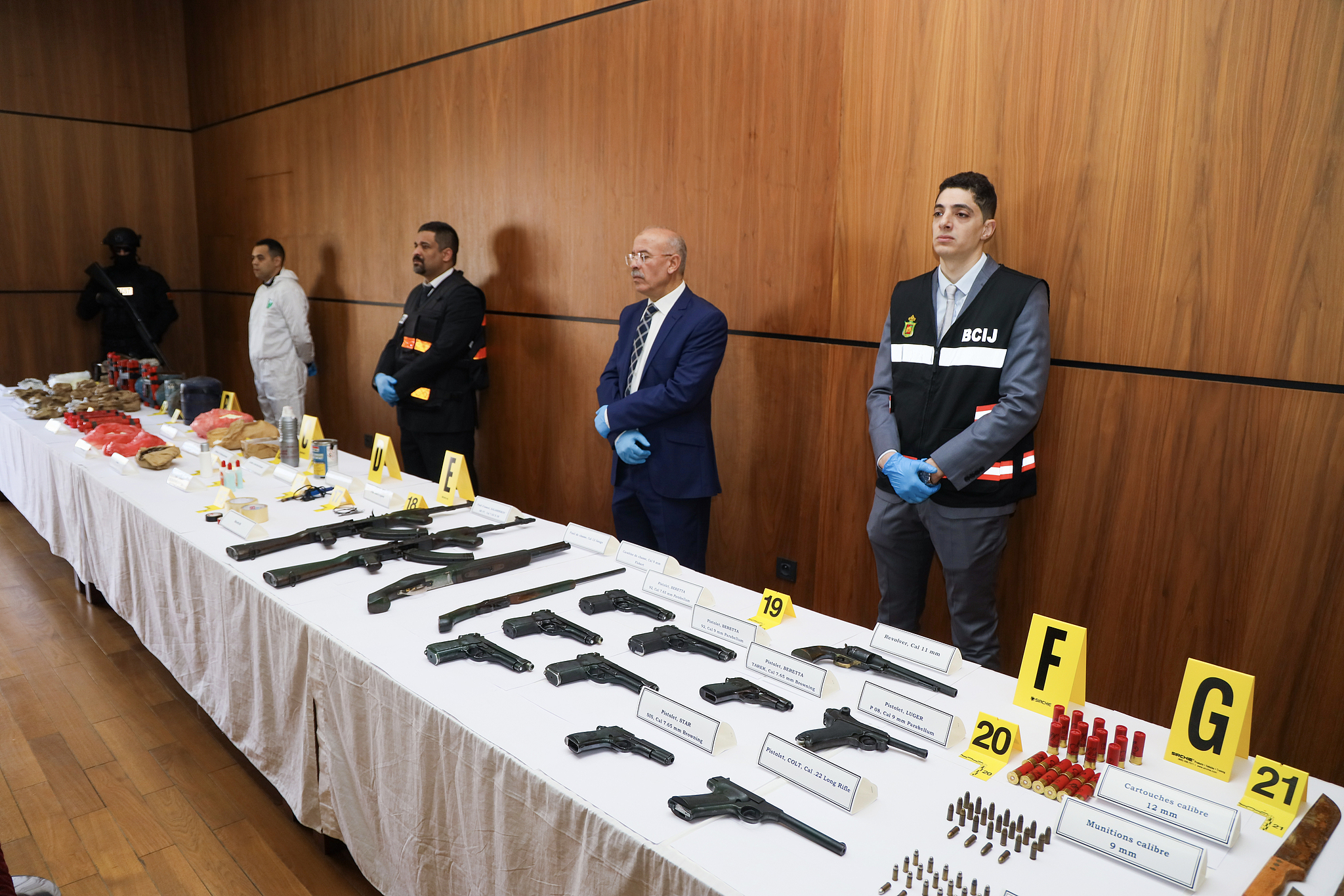 FILE: Weapons seized from cells loyal to the Islamic State group in the Sahel region, according to Morocco's counter-terrorism agency, are displayed at the headquarters of the Central Bureau of Judicial Investigations (BCIJ) during a press conference to highlight the dismantling of a terrorist cell linked to the Islamic State group in Sale, Morocco, 24 February 2025./CFP