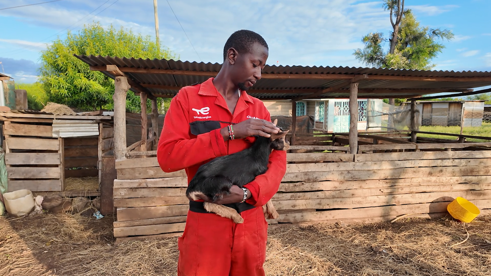 Farmer Peter Njoroge holding a goat kid in his farm in Kirinyaga County, Central Kenya, July 11, 2026. /CGTN Africa