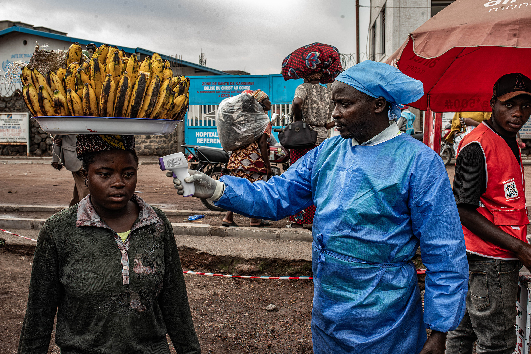 A health worker takes a woman's temperature as part of Ebola screening efforts in Goma, Democratic Republic of Congo, June 24, 2026. /CFP