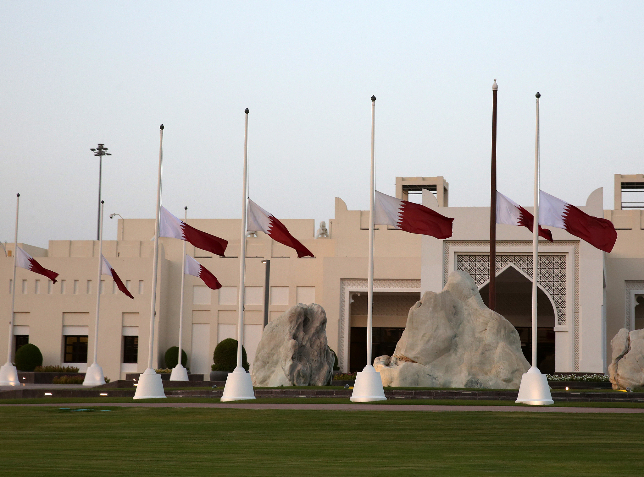 Qatari national flags are flown at half-mast above a government building after the death of Emir Sheikh Hamad bin Khalifa Al Thani in Doha, Qatar, July 12, 2026. /CFP
