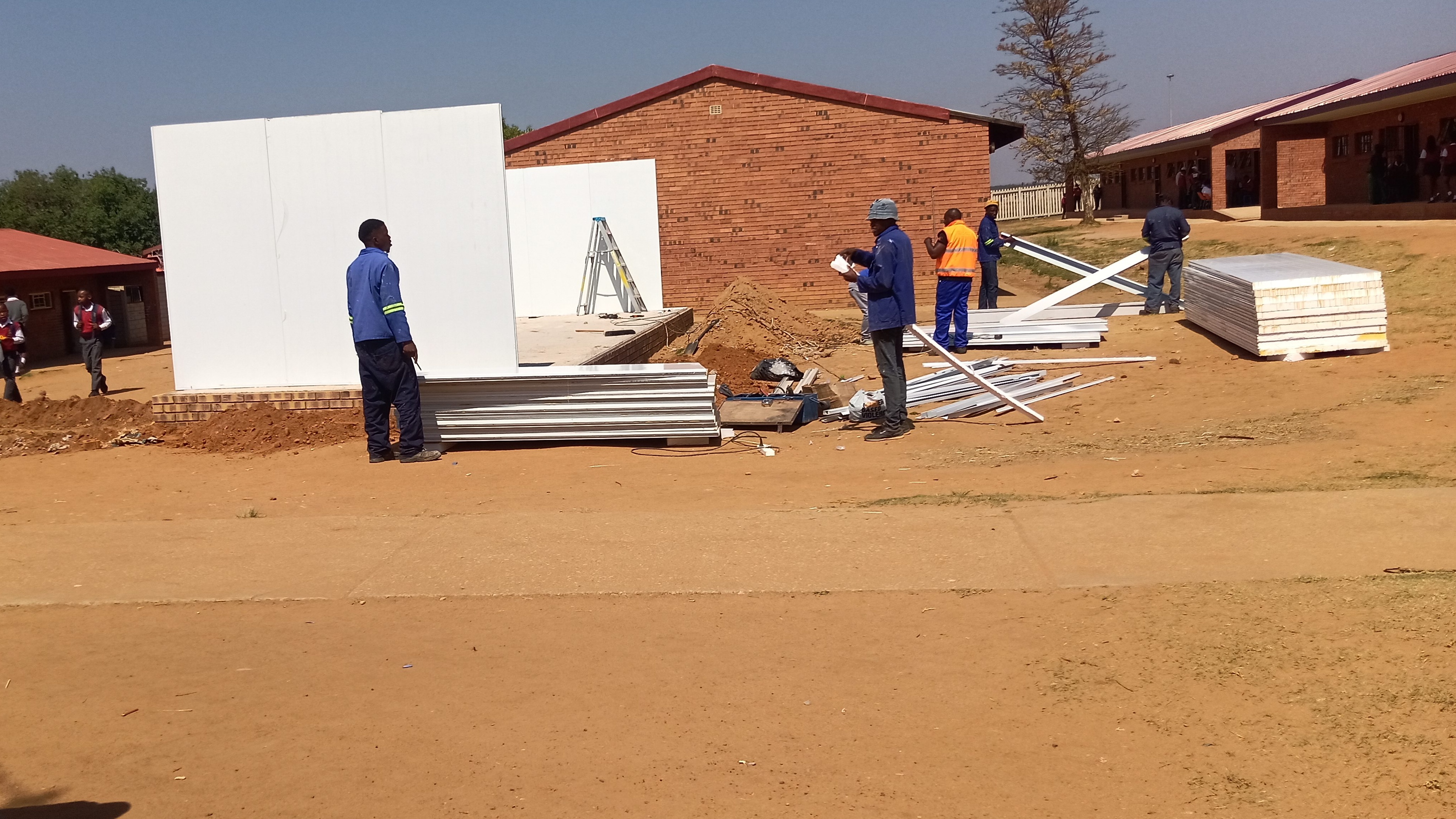 Kusile Labs & Technology workers assemble a modular science structure at Pine Ridge Combined School in Mpumalanga, September 2, 2022. /Kusile Labs & Technology