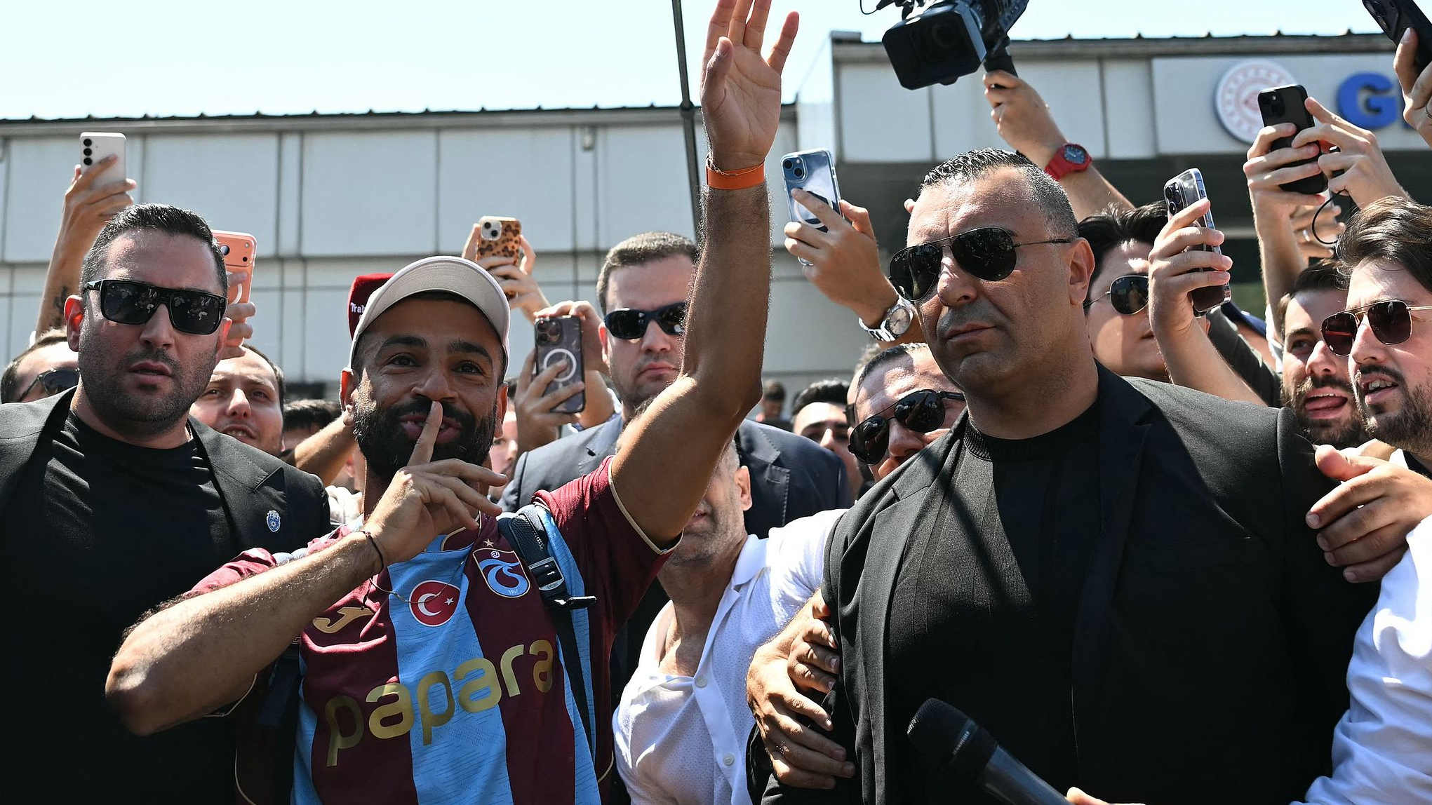 Egyptian forward Mohamed Salah gestures as he arrives at Istanbul Ataturk Airport to complete his transfer to Turkish football club Trabzonspor in Istanbul on August 5, 2026. /AFP