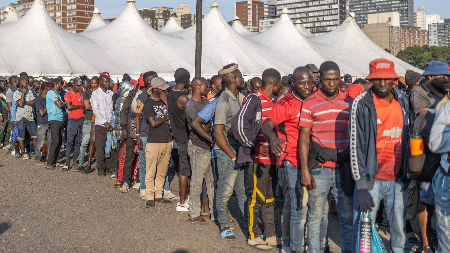 Hundreds of newly displaced male foreign nationals lined up for lunch at the old Durban Drive Inn. As one of Africa's largest and most industrialized economies, the country has been on edge following weeks of sometimes violent attacks, South Africa, June 22, 2026. /CFP