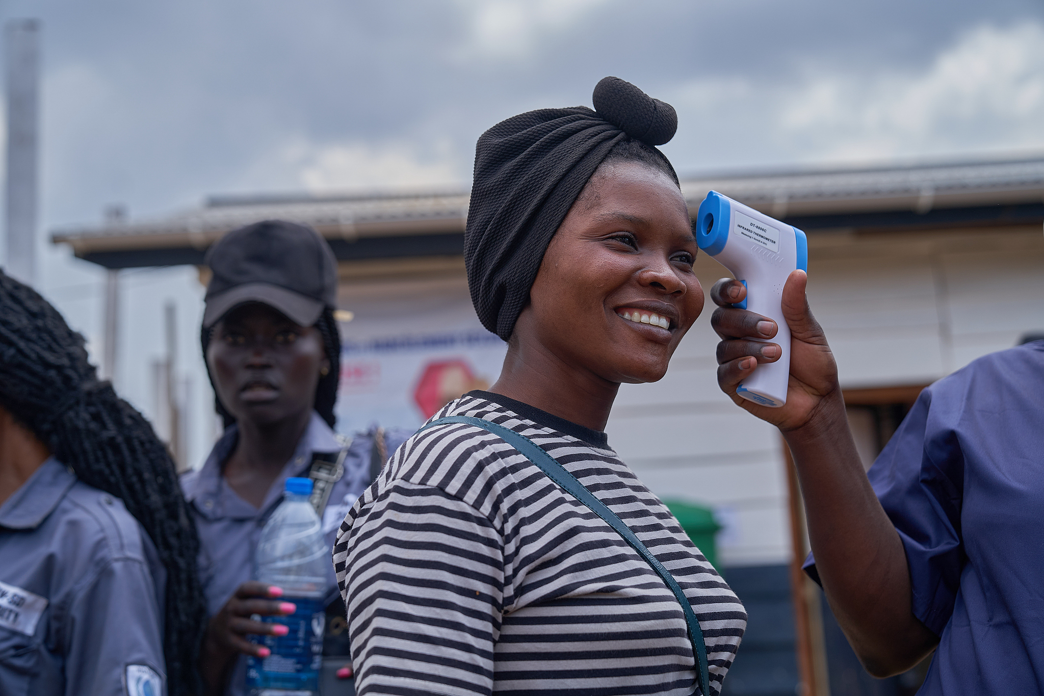 A woman has her temperature checked at the newly inaugurated Ebola treatment center, Rwakole, Bunia, the Democratic Republic of the Congo, August 4, 2026. /CFP