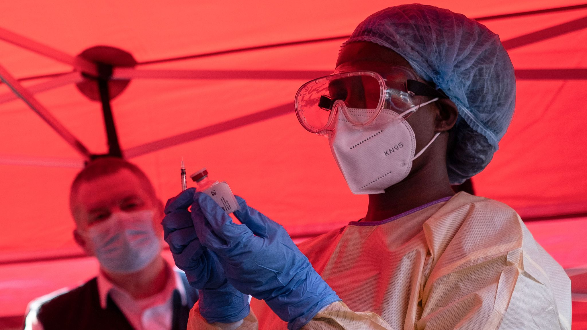 FILE: A nurse wearing protective medical gear was preparing syringes to extract a dose of the vaccine from the vial in preparation for the Ebola vaccine administration campaign in Kampala, Uganda, February 3, 2025. /CFP