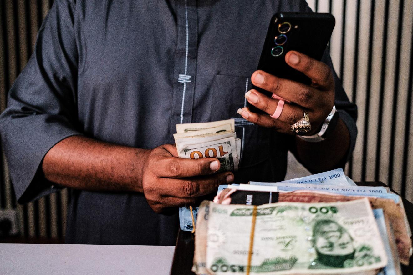 Nigerian naira and US dollar banknotes at a currency exchange bureau in Lagos, Nigeria, on Monday, Jan. 26, 2026. /CFP