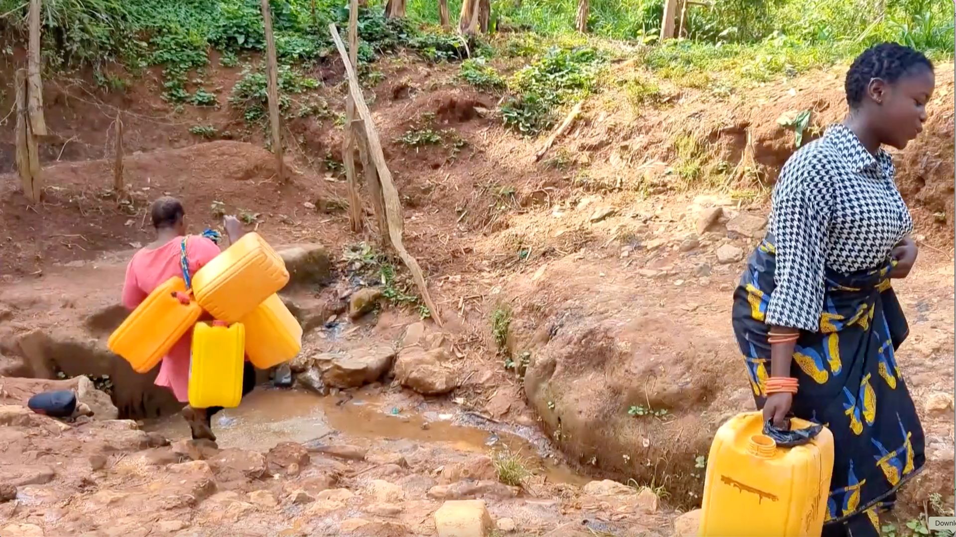 Locals fetch water from a nearby spring in Mongbwalu town, Democratic Republic of Congo. /CGTN Africa