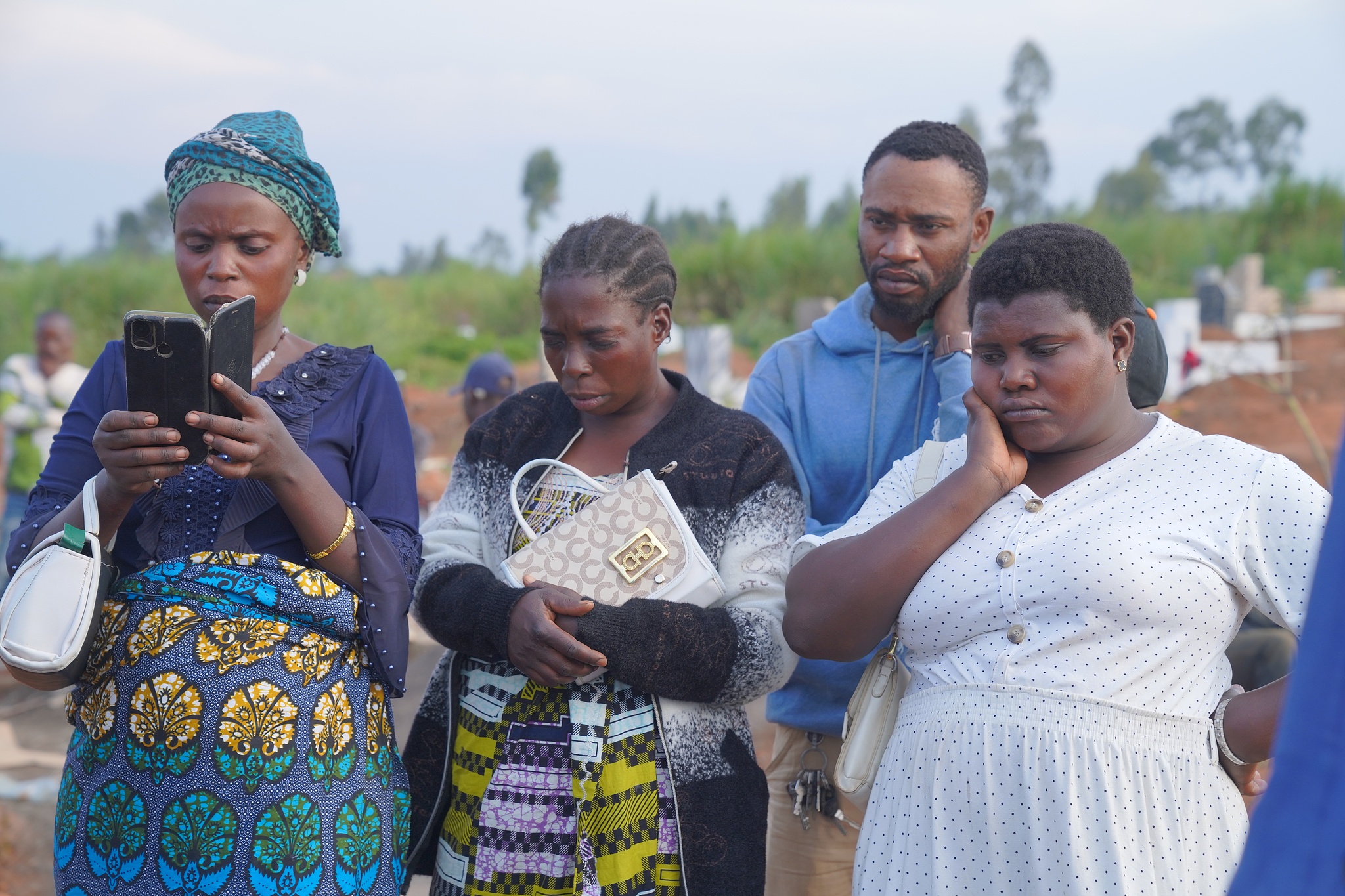 Family and friends gather for a burial service for 3-year-old Mave Mercienne, who died of Ebola, in Bunia, Ituri province, eastern Democratic Republic of the Congo, August 18, 2026. /CFP