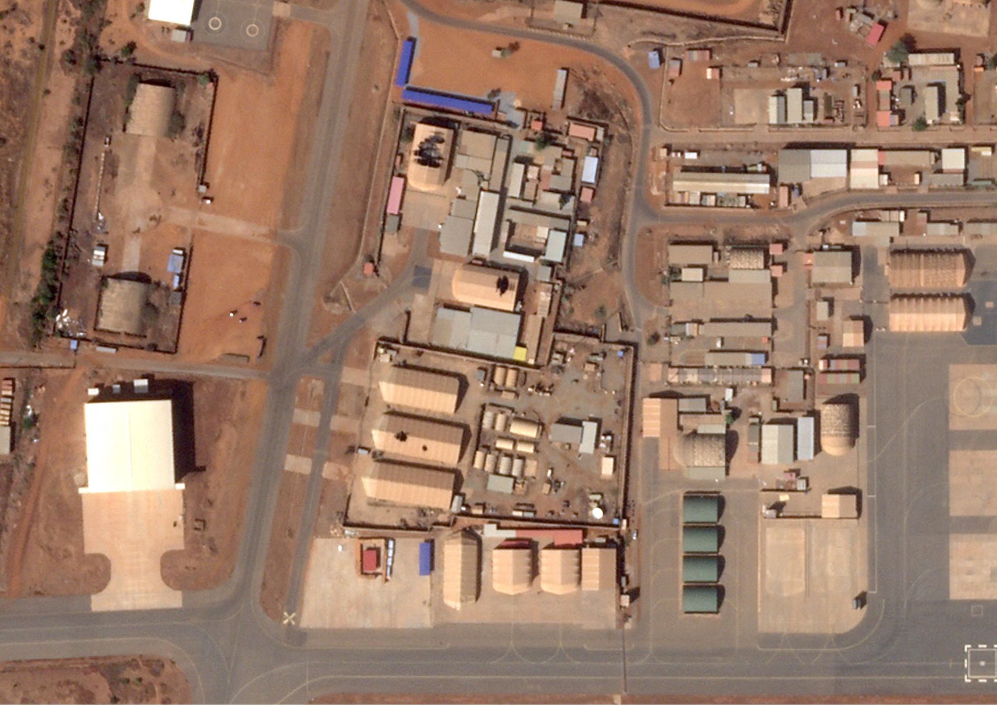  This handout satellite image taken by 2026 Planet Labs PBC on January 29, 2026 shows the Niamey airport in Niger, where damage is visible on the roofs of hangars. /CFP