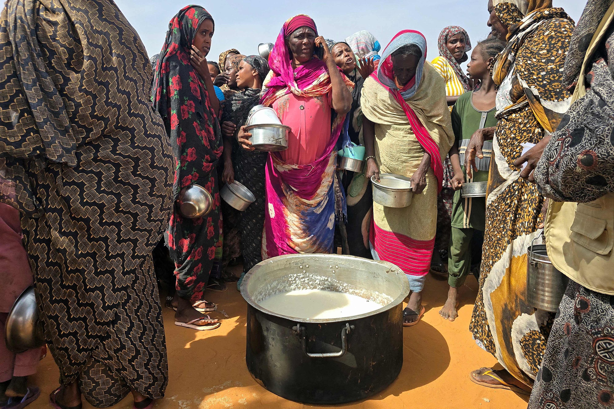 Sudanese women gather for a hot meal in al-Rahmaniyah camp for displaced people, near the city of El-Obeid in the southern Kordofan region, Sudan, July 7, 2026. /CFP