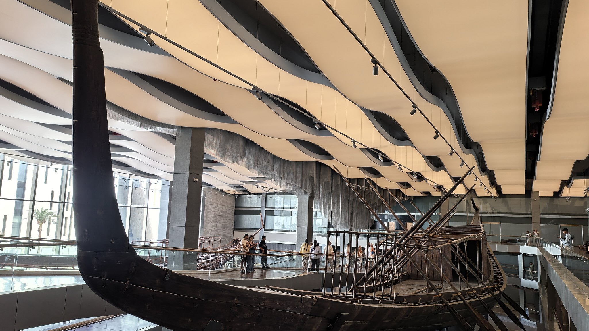 Tourists view the Khufu Solar Boat at the Grand Egyptian Museum in Cairo, Egypt, August 31, 2026. /CFP