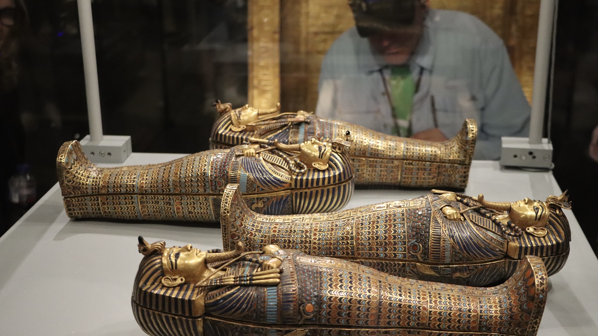 Artifacts, including a huge statue of Ramses II, Tutankhamun's golden mask, and a human-shaped mummy coffin are exhibited at the Grand Egyptian Museum in Cairo, Egypt, February 17, 2026. /CFP