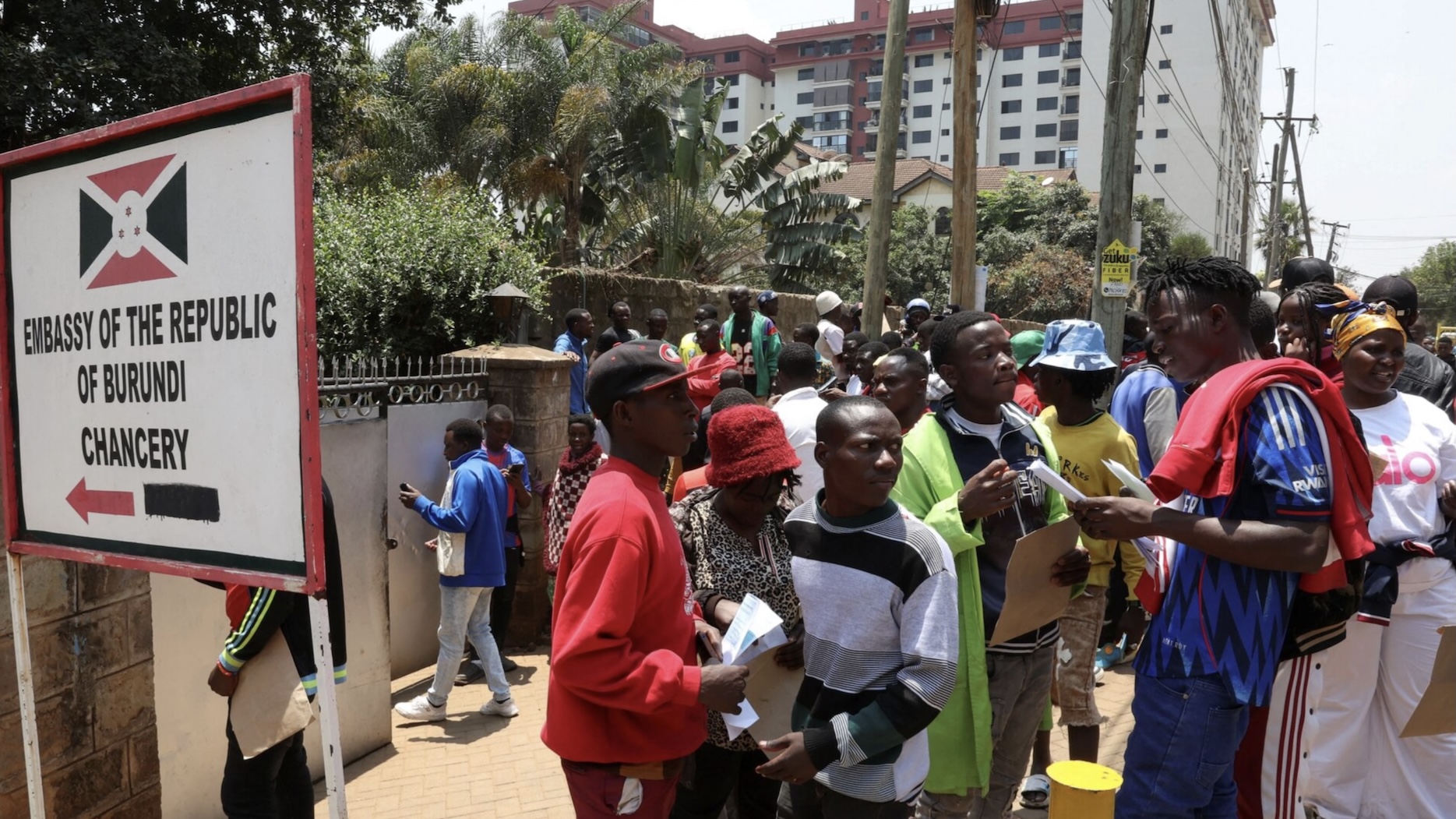 Burundi nationals stand outside their country's embassy as they seek travel documents to return home after Kenyan President William Ruto ordered a crackdown on small-scale traders from abroad, in Nairobi, Kenya, September 7, 2026. /Reuters

