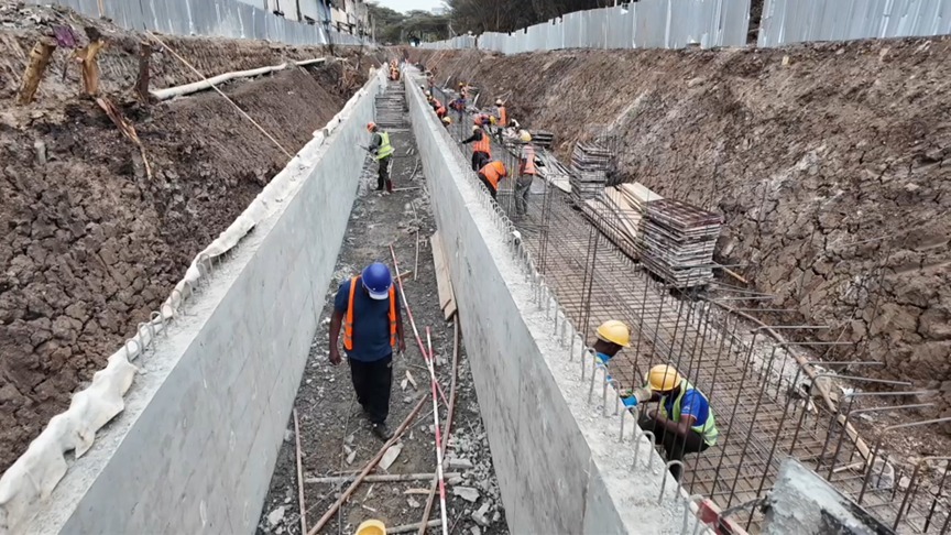 Nairobi County workers constructing reinforced concrete drainage channels in Nairobi. /CGTN Africa