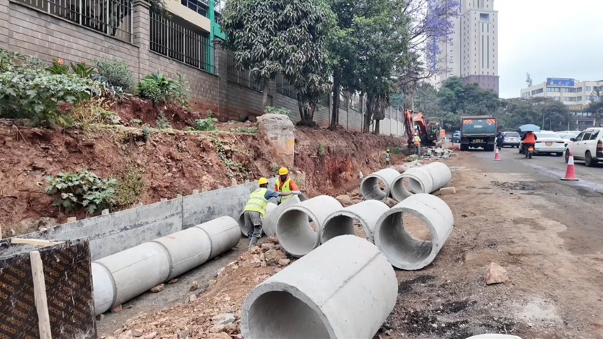 Nairobi County workers lay drainage pipes to boost the city’s stormwater capacity. /CGTN Africa