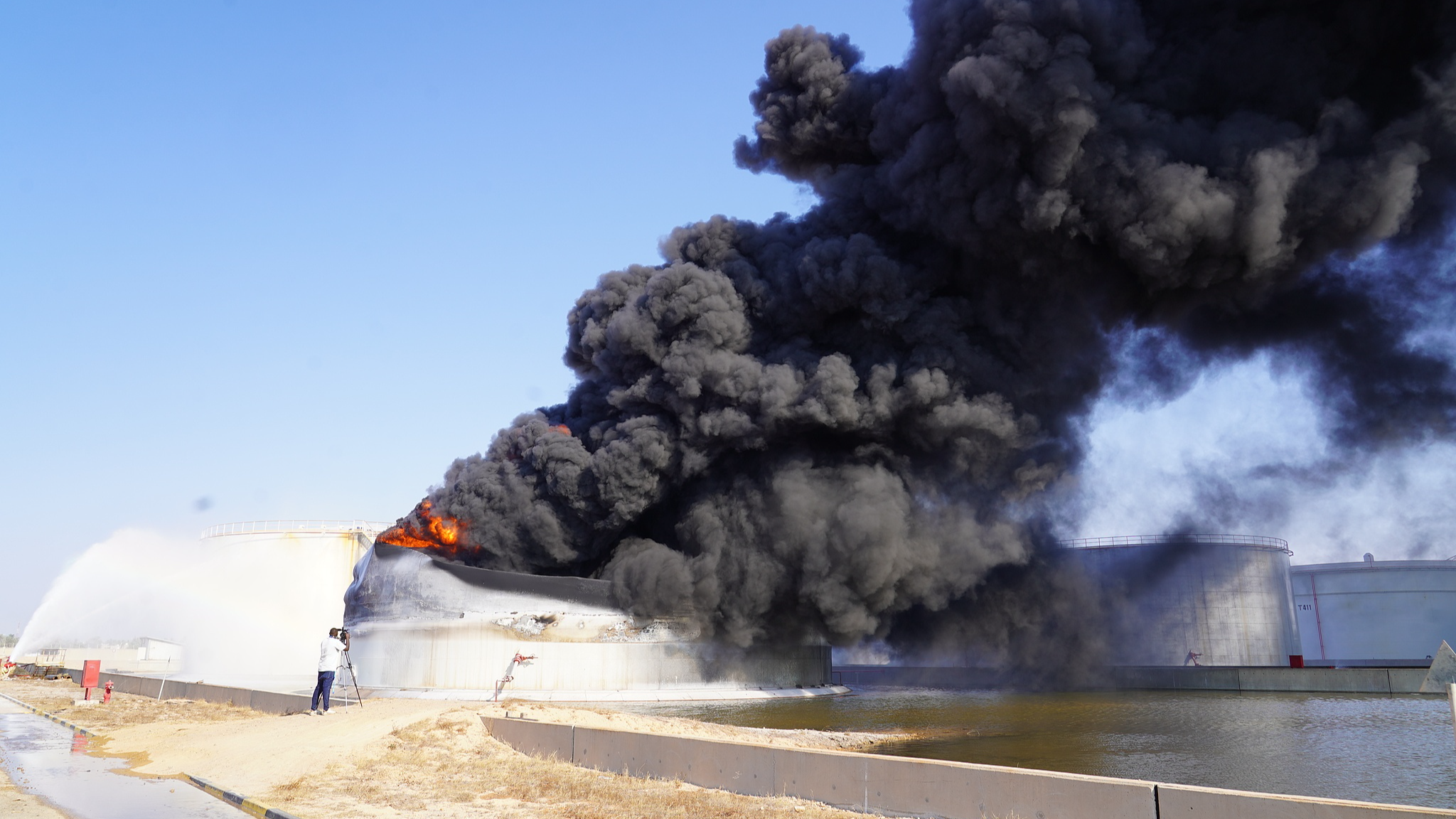 FILE: Firefighters extinguish a blaze inside a diesel tank at the Zawiya Oil Complex, west of Tripoli, Libya, Tuesday, August 11, 2026. / CFP