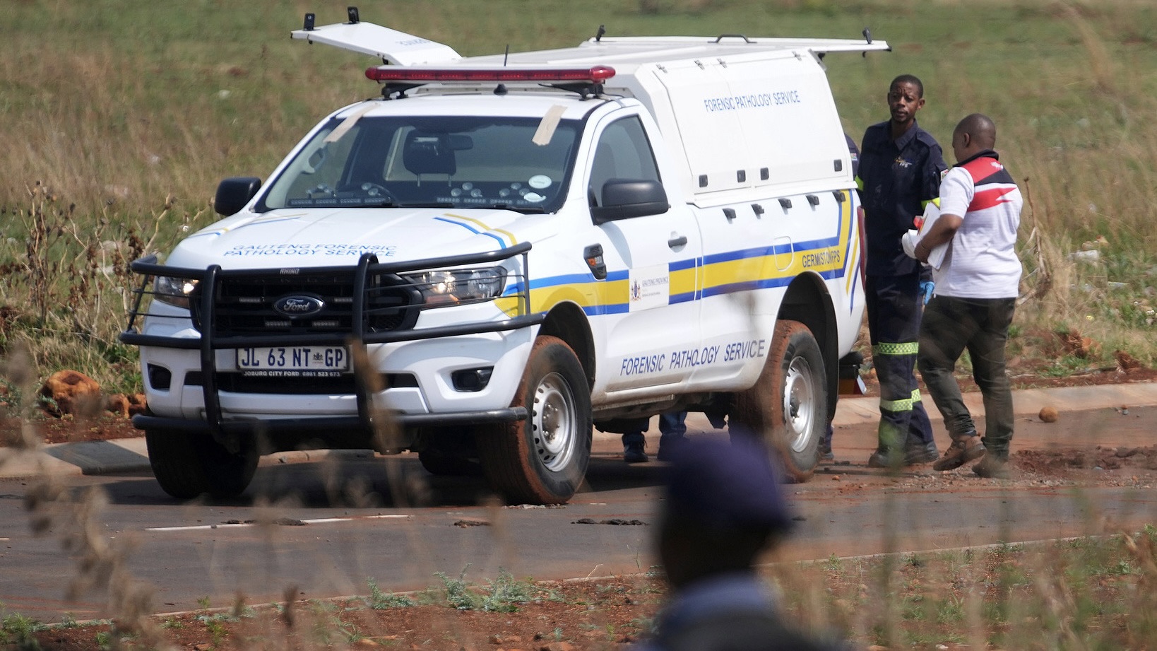 Forensic investigators work at the site where the body of a woman was discovered on the outskirts of Johannesburg, South Africa, on Thursday, September 17, 2026. /CFP