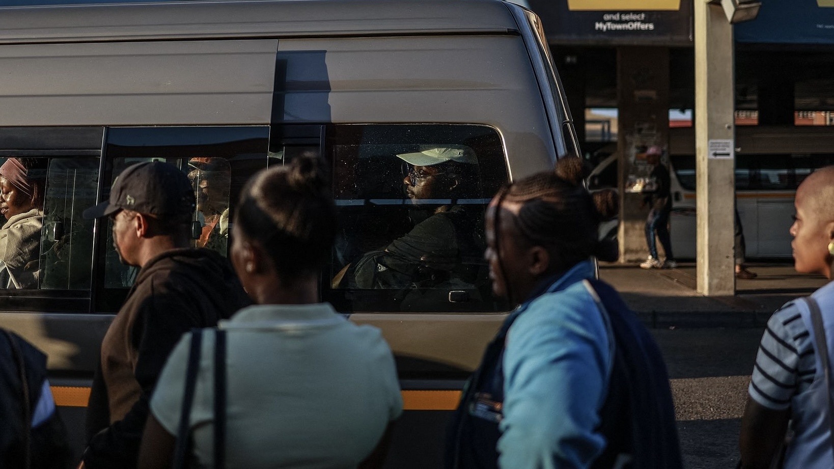 Commuters queue to board a minibus taxi at the Bara Taxi Rank in Soweto on April 1, 2026. /CFP