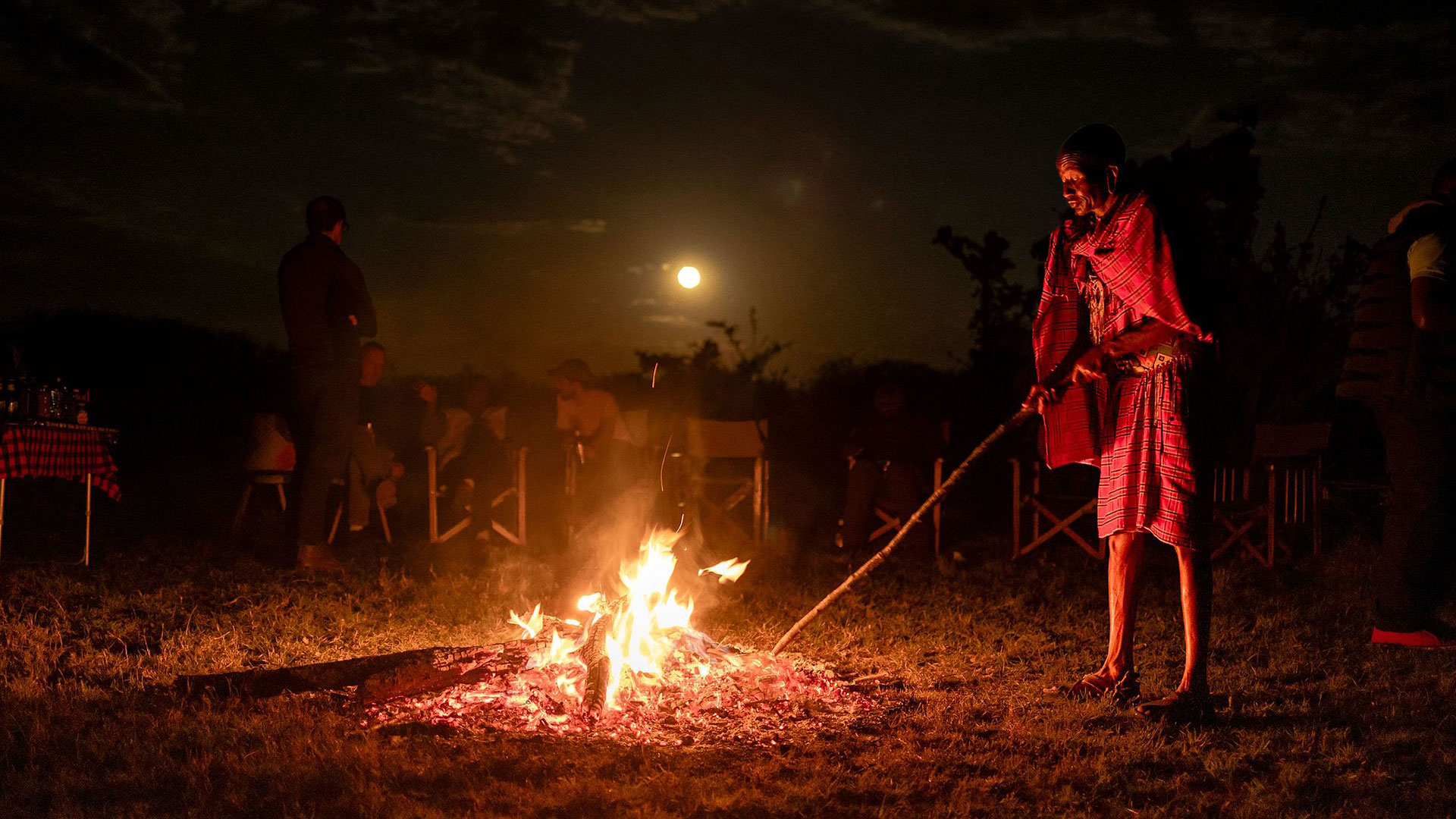 The moon rises above a campfire at the Nashulai Maasai Conservancy in Narok County, Kenya, October 7, 2025. /VCG