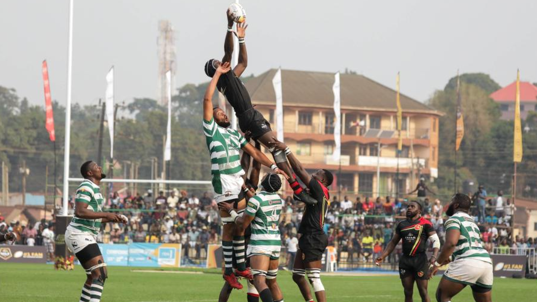 Players vie for the ball during the Rugby Africa Cup quarter-final match between Uganda and Zimbabwe at Mandela National Stadium in Kampala, Uganda, July 20, 2024. /CFP
