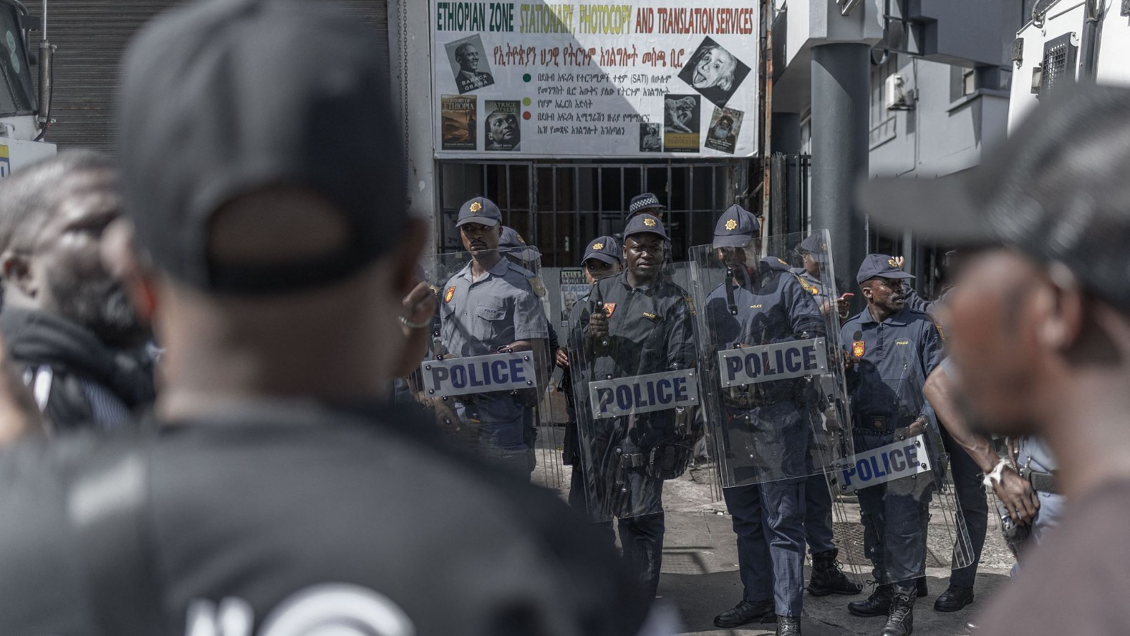 Members of the South African Police Service stood guard outside the Department of Home Affairs Refugee Reception Centre on Che Guevara Road after the anti-illegal immigration group 