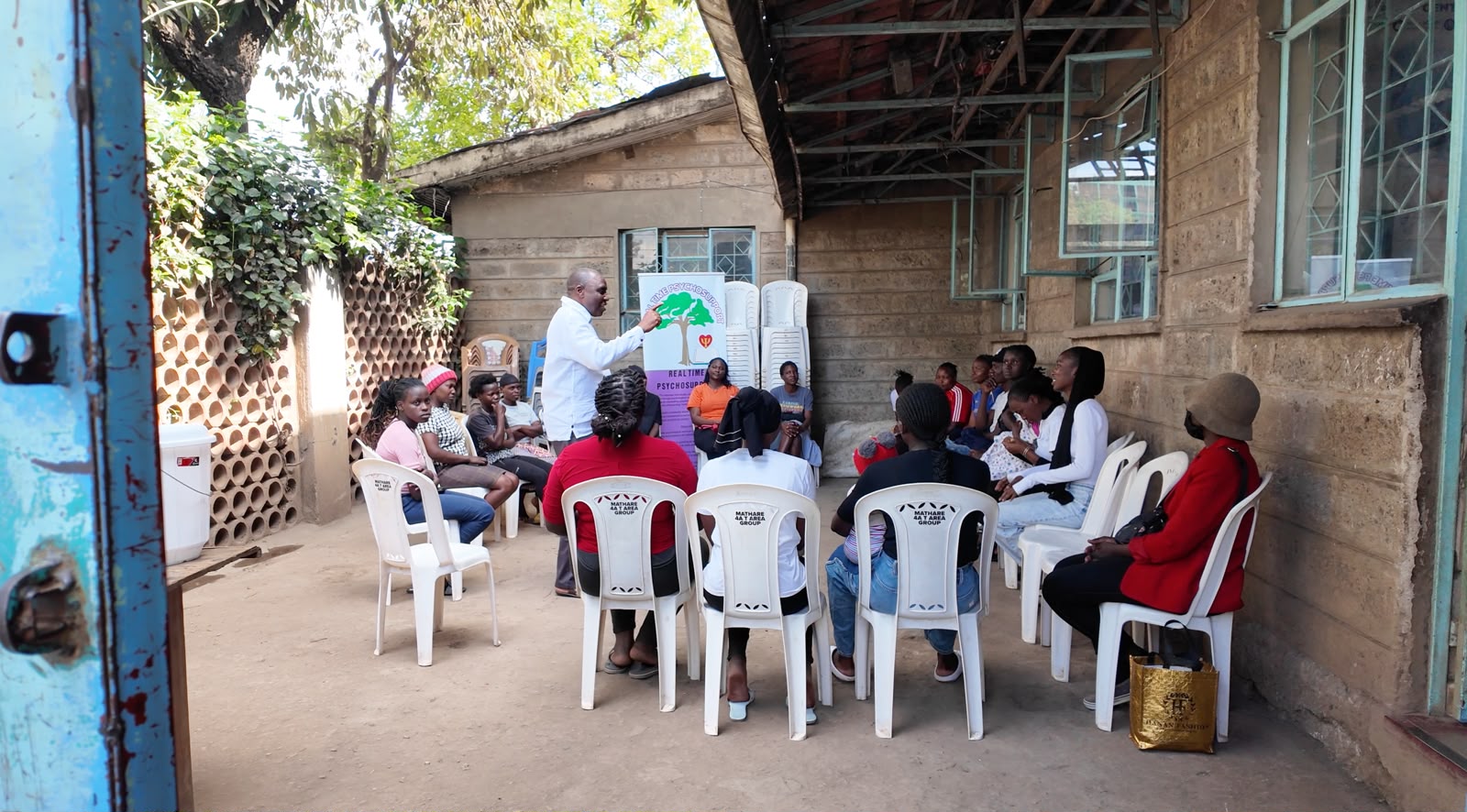 Dr. Oliver Mbayi (C), a psychodrama practitioner and founder of Global Arts Intervention, speaks to participants during a pyschodrama session in Mathare, Nairobi, Kenya, October 7, 2026. /CGTN