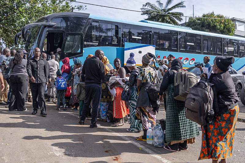 Migrants lined up at Sherwood Park, Durban, South Africa, to board the first of seven buses, preparing to return to Malawi, June 14, 2026. /VCG