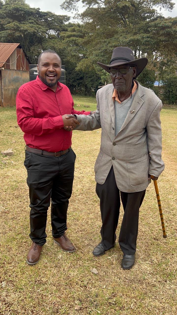 CGTN reporter Enoch Sikolia (left) stands with Ephraim Matindi Hinga in Kenya, on October 9, 2026. /CGTN