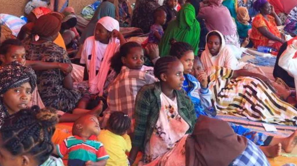 Ethiopians sit at a holding ground after fights erupted in the Ethiopian border town of Moyale, Kenya, October 23, 2026./Reuters
