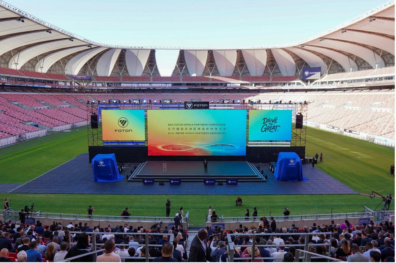 A conference presentation takes place inside Nelson Mandela Bay Stadium during the automotive partnership gathering in Gqeberha, South Africa, October 28, 2026. /BAIC FOTON International